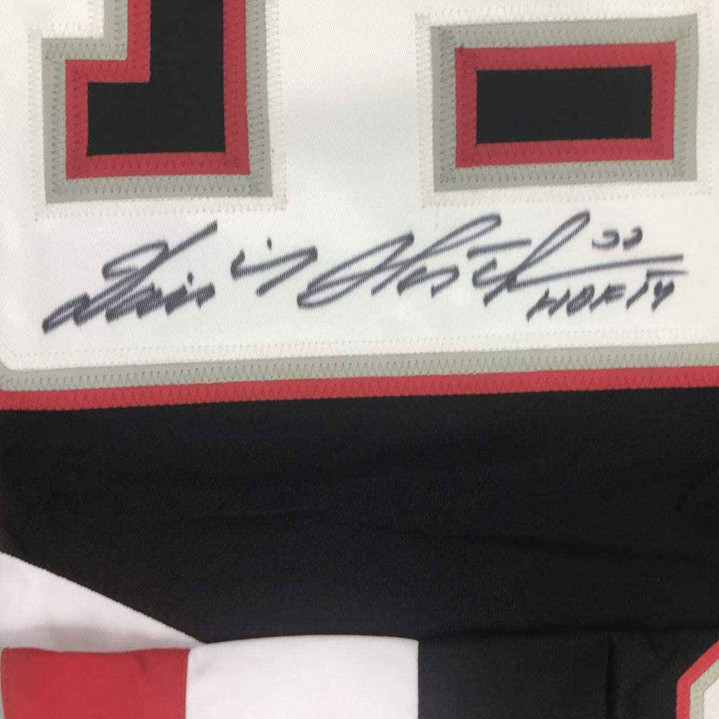 Autographed/Signed Dominik Hasek HOF 14 Buffalo Black Hockey Jersey JSA COA