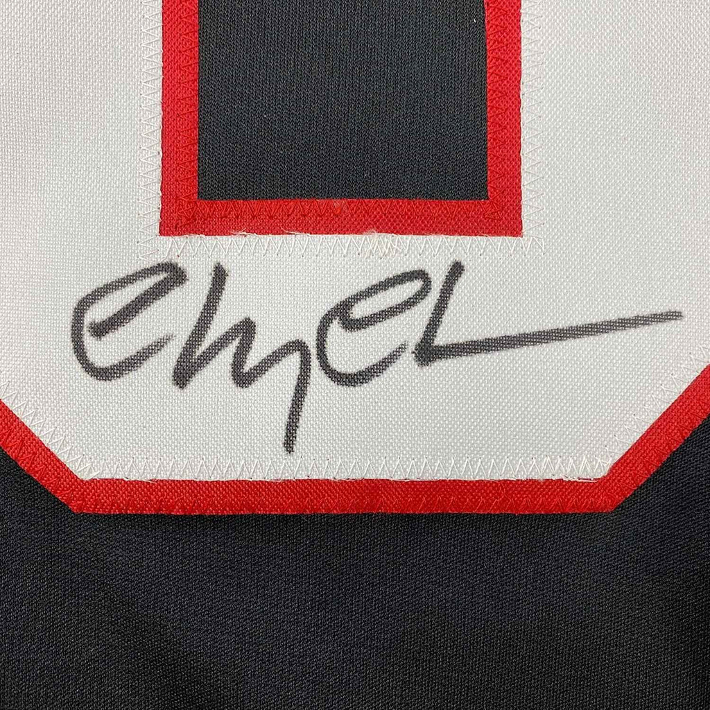 Framed Autographed/Signed Chevy Chase Clark Griswold 35x39 Christmas Vacation Movie Chicago Black Hockey Jersey Beckett BAS COA