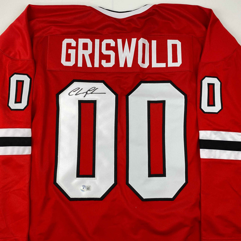 Autographed/Signed Chevy Chase Clark Griswold Christmas Vacation Movie Chicago Red Hockey Jersey Beckett BAS COA